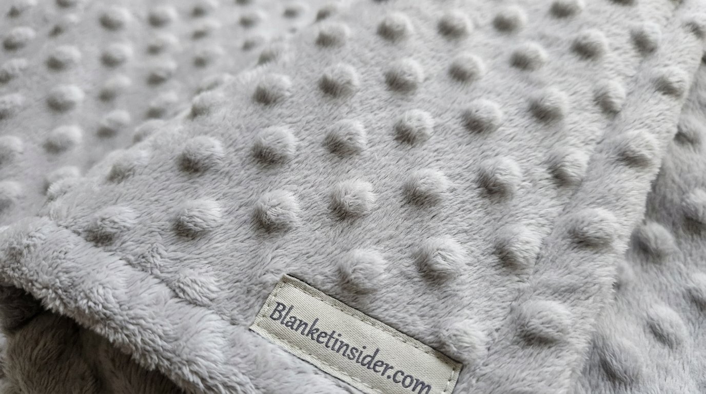Close-up of plush minky fabric texture showing raised dot pattern