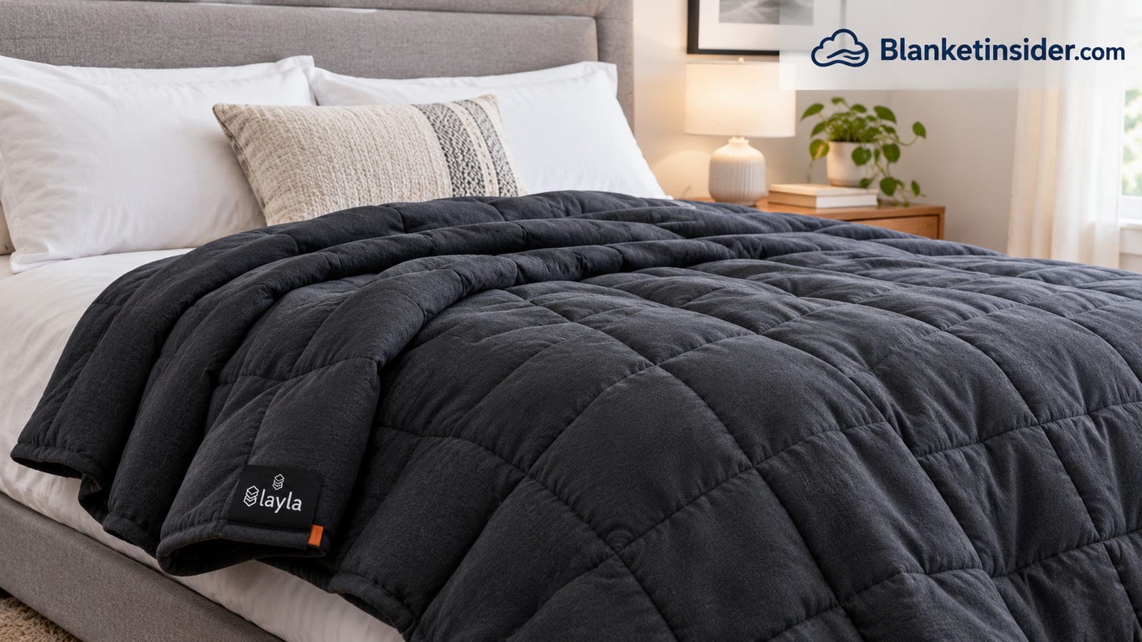 Layla weighted blanket draped over a bed